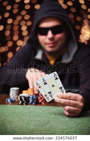 Winning hand / Poker player show his hand in a casino