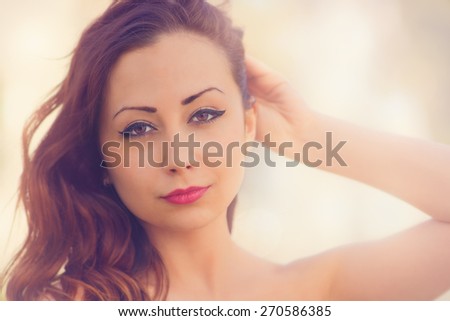 Cute, attractive woman, close up photo with color filters, glow effects, and some fine film grain added