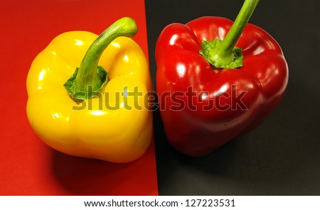 Red and Yellow Pepper on red and black background