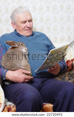 man with rabbit read magazine