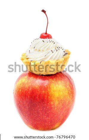 big red apple and cake on it. isolated on white