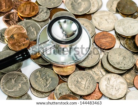 stethoscope on currency coin for financial examination healthy concept