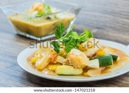 Sweet and sour shrimps on white plate