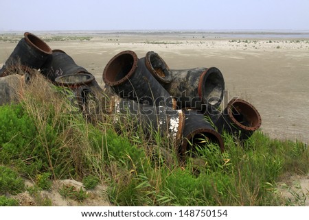 wasted objects, blowing sand pipe, closeup of photo