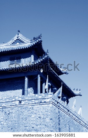 tower over a city gate, ancient Chinese style in a scenic spot, china