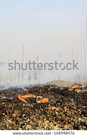 TANGSHAN - NOVEMBER 20: The vehicles were clearing up rubbish after fire, November 20, 2013, tangshan city, hebei province, China.