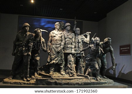 TANGSHAN, CHINA - OCTOBER 18: The Kailuan coal mine workers strike sculpture in the kailuan museum on October 18, 2013, tangshan city, hebei province, China.