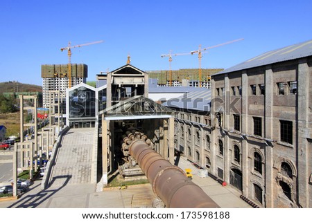 TANGSHAN - NOVEMBER 4: old workshop and rotary kiln in the Qixin cement plant on november 4, 2013, tangshan city, hebei province, China.