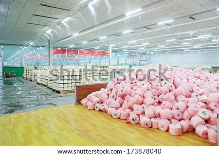 LUANNAN COUNTY - DECEMBER 20: The cotton reel thread piled up together in a production workshop, in the ZeAo spinning LTD., on December 20, 2013, Luannan county, hebei province, China.