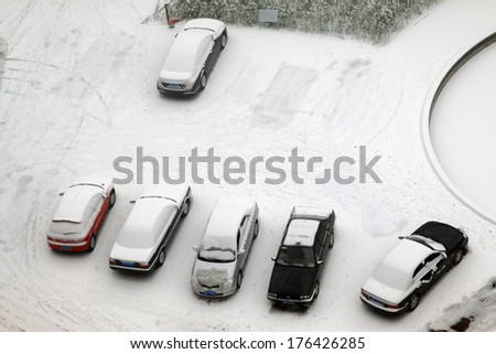 TANGSHAN CITY - JANUARY 16: The cars covered with snow on january 16, 2014, tangshan, china.