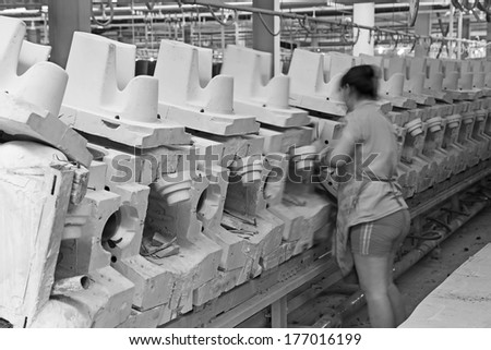 LUANNAN COUNTY - JANUARY 5: woman worker in the production line, in the ZhongTong Ceramics Co., Ltd. January 5, 2014, Luannan county, Hebei Province, China.