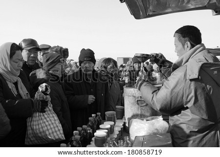LUANNAN COUNTY - JANUARY 28: vendor busy filling balm, in refined balm booth, on january 28, 2014, Luannan county, Hebei province, China.