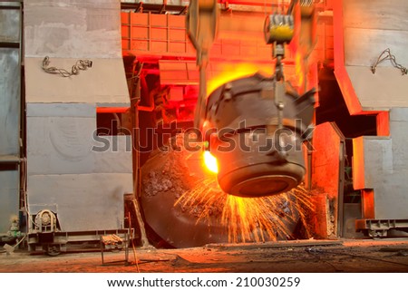 TANGSHAN - JUNE 18: converter filling scrap iron and steel, in a iron and steel co., on June 18, 2014, Tangshan city, Hebei Province, China