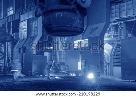 TANGSHAN - JUNE 18: Technical staff check the quality of molten steel, in a iron and steel co., on June 18, 2014, Tangshan city, Hebei Province, China