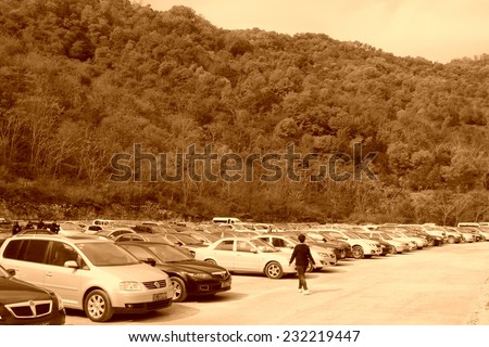 BENXI - OCTOBER 4: Many cars parked in parking of a scenic spot on October 4, 2013, Benxi city, Liaoning province, China