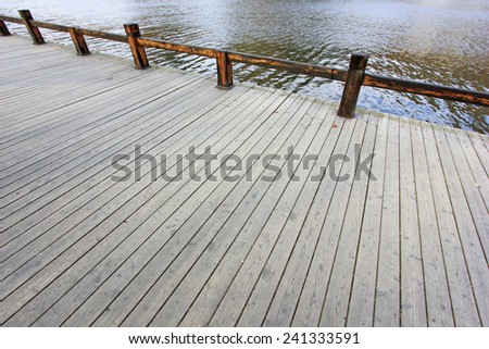 Wood floors and railings in the park, closeup of photo