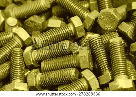 bolts piled up together, closeup of photo
