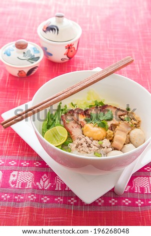 Sukhothai noodle soup in Thailand, On red table linen elephant texture (Noodle, Thai Noodle, Thailand Food)