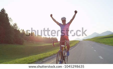 Similar – Image, Stock Photo Cyclist rides through image