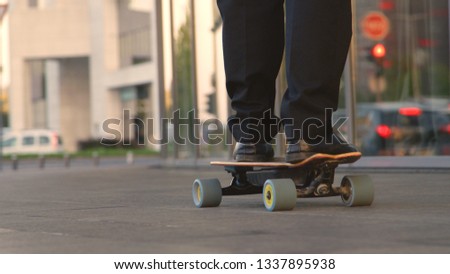 Similar – Image, Stock Photo Unrecognizable man with skateboard and backpack in city