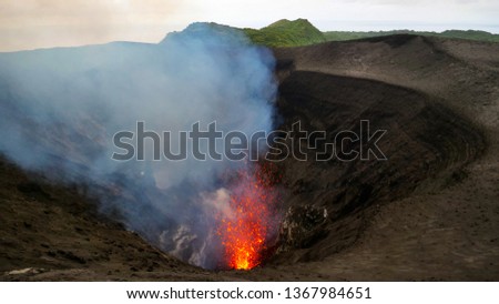 Similar – Image, Stock Photo Bright orange lava emitting out of volcano at night