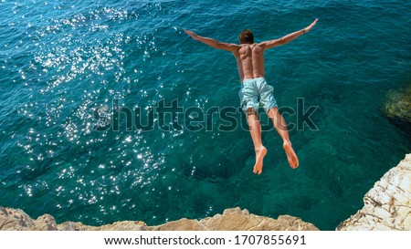 Similar – Image, Stock Photo Unrecognizable man on cliff near sea