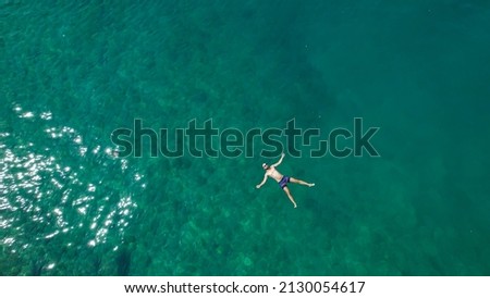 Similar – Image, Stock Photo Man swimming in turquoise natural bay