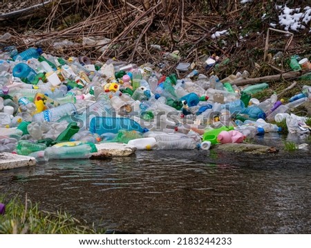 Image, Stock Photo Plastic waste in branches of a bare tree in front of a glass facade