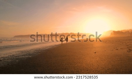 Similar – Image, Stock Photo Surfer friends at the beach with surfboards taking selfie with mobile phone