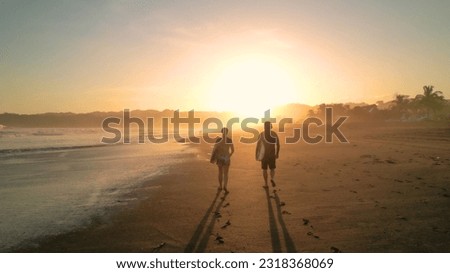 Similar – Image, Stock Photo Surfer friends at the beach with surfboards taking selfie with mobile phone