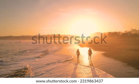 Similar – Image, Stock Photo Surfer friends at the beach with surfboards taking selfie with mobile phone