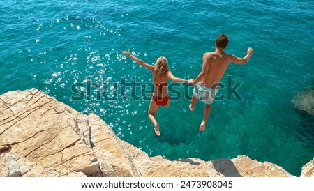 Similar – Image, Stock Photo Unrecognizable woman enjoying freedom near waving sea