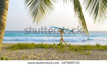 Image, Stock Photo Female surfer walking at the beach with surfboard