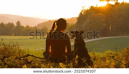 Similar – Image, Stock Photo caucasian woman and dog in park in springtime at sunset. Love and friendship concept. pets outdoors