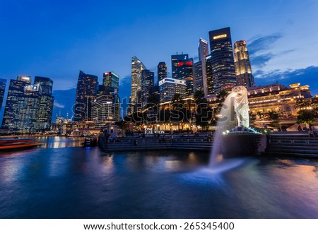 SINGAPORE - MARCH 2, 2015: Sunset scene of Singapore skyline with merlion on march 2, 2015. Merlion fountain is one of the most famous tourist attraction in Singapore.