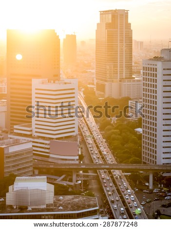 Aerial view of sunset in the Bangkok city with a very long traffic queue