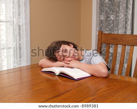young boy fell asleep while reading