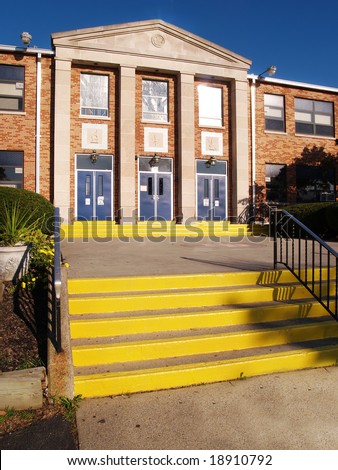 front entrance and steps for an old catholic high school