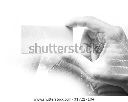 Double exposure of a man\'s hand with business card, Black and white