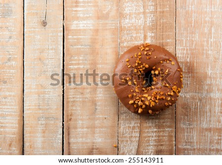 Sweet donut for a great morning breakfast on wood