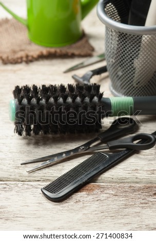 hairdresser tools on white wood