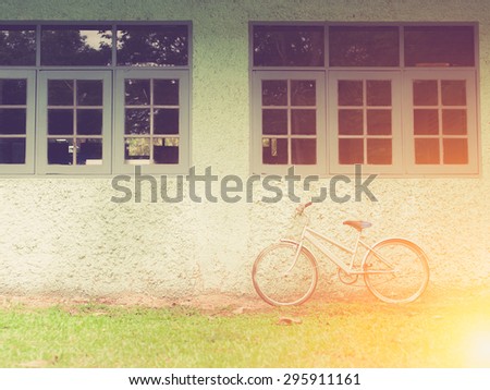 Vintage bike against wall,vintage tone style