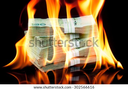 Thai money bill on fire with black background