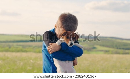 Similar – Image, Stock Photo Child kindly caresses his dog