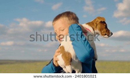 Similar – Image, Stock Photo Child kindly caresses his dog