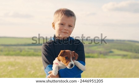 Similar – Image, Stock Photo Child kindly caresses his dog