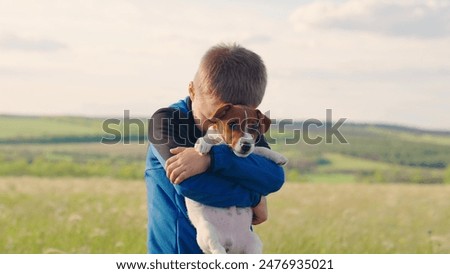 Similar – Image, Stock Photo Child kindly caresses his dog