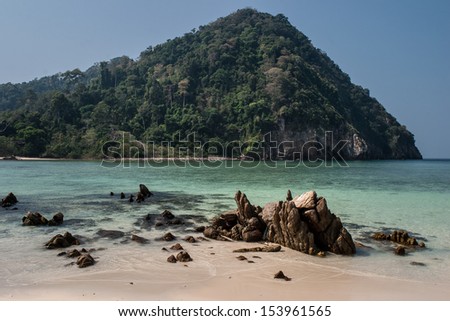 A remote beach is littered with rocks in the Mergui Archipelago in Myanmar. These remote islands are home a diverse set of reef-associated marine life.
