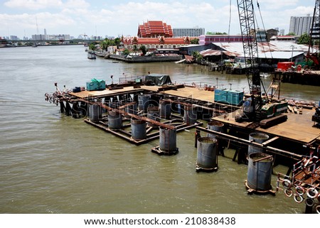 NONTHABURI -THAILAND - AUGUST 12 : Concrete bridge across Chaophraya river under-construction of its deep long pile foundation on August 12, 2014 in Nonthaburi, Thailand