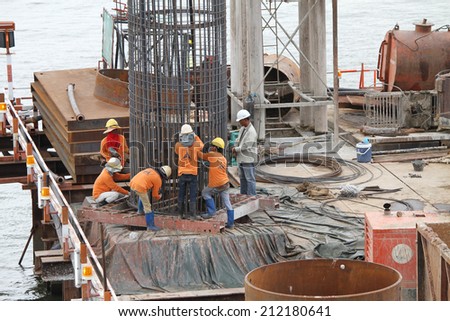 NONTHABURI -THAILAND - JUNE 21 : Concrete bridge across Chaophraya river under-construction of its deep long pile foundation on June 21, 2014 in Nonthaburi, Thailand